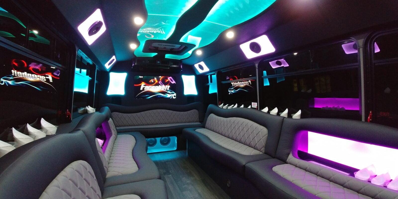 Limo bus interior — leather seating, LED ceiling, premium sound system